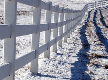 A fence marks the perimeter of a plot of land.