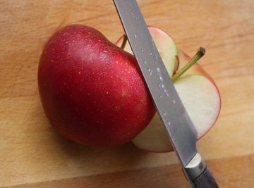 Cut apples turn brown because of an enzymatic reaction.