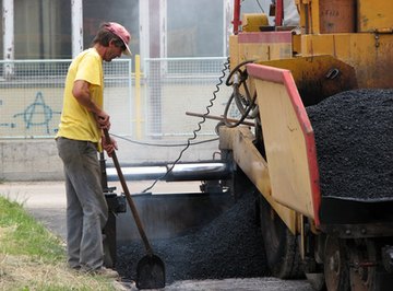 Surface area, thickness and the density of asphalt paving material are used to compute the required quantity of asphalt.