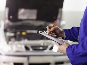 Man working on car engine