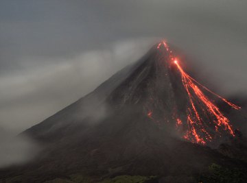 Example of a volcano with lava running down the side.