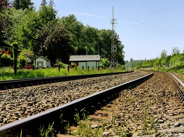 Metal railroad tracks get hot faster than the ties holding them