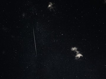 Meteors are observed in the night sky as a streak of light. 