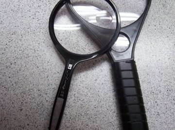 The formulas for magnification of single, thin lenses work well for magnifying glasses.