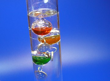 The small medallions attached to Galileo thermometer spheres are actually calibrated counterweights.