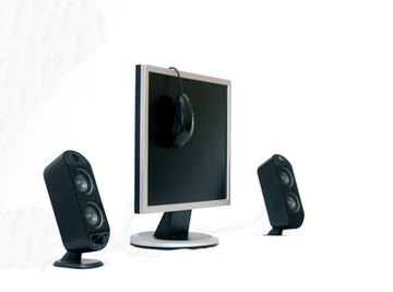 Without shielding, magnets in these speakers would interfere with the monitor.