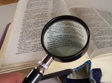 The elderly commonly use magnifying glasses to read small print.