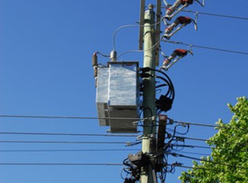 Electrical and communication wires are arranged on an electrical pole in hierarchical zones.