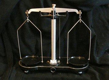 An old-fashioned equal arm beam scale with two pans