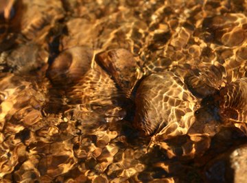 Gold ore can travel down rivers and streams.