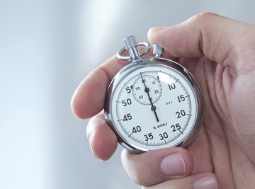 Close-up of hand holding stopwatch