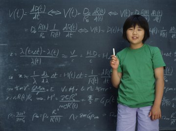 Student holding chalk in front of board with math problems