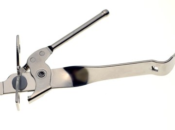 A manual can opener looks simple but is quite ingenious.