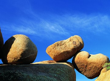 Granite boulders like these are shaped by spheroidal weathering.