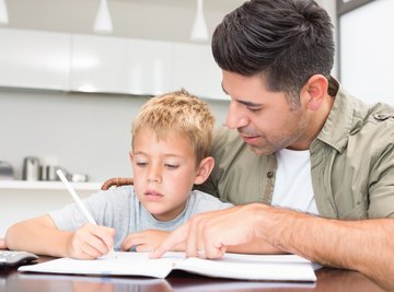 Father helping son with math homework