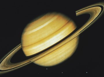 As the helium and hydrogen seperate on Saturn, the friction creates heat.