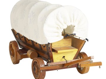 Covered wagons carried mostly provisions and sheltered pioneer families while they built houses.