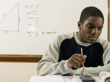 Student working on math homework in classroom.