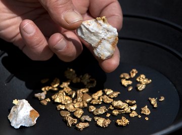 Gold flakes and nuggets are found in placer deposits in some rivers.