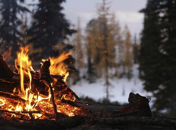 Rapidly expanding gases make burning wood crackle.