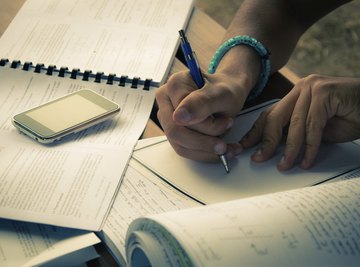 Close-up of student working on math homework.