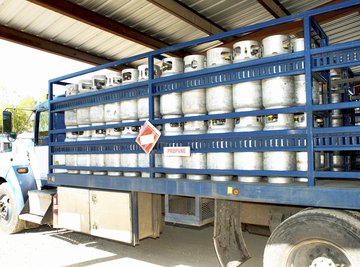 Propane tanks being shipped on a truck.