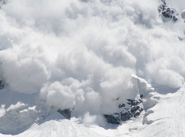 An avalanche coming down a mountain.