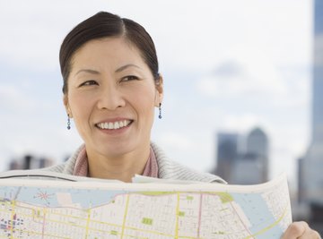 Woman holding up map