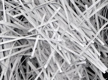 Close up of shredded paper in recycling bin.