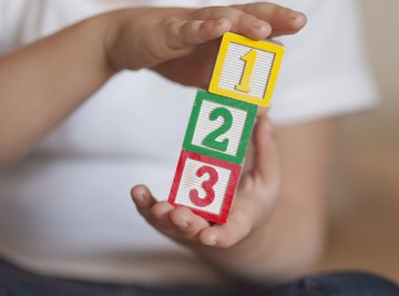 Close-up of counter blocks with numbers written on them