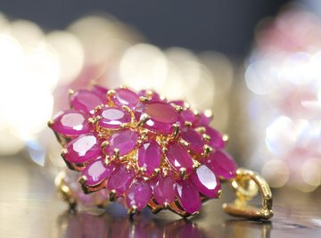 Gold pendant filled with rubies.