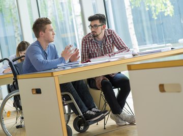 Student in wheelchair sitting at desk