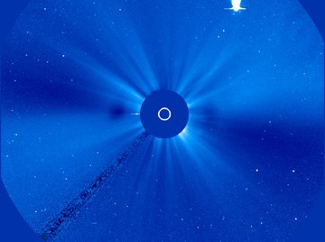 The coma and tail of a comet are visible when the comet approaches the sun.