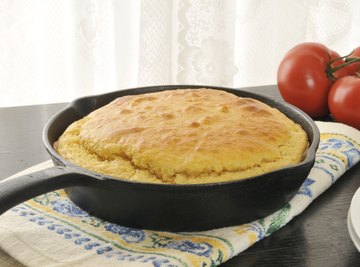 Cast iron skillet cooling on table.