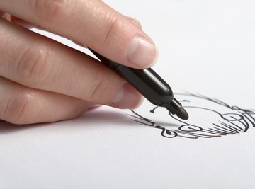 Close-up of hand drawing cartoon