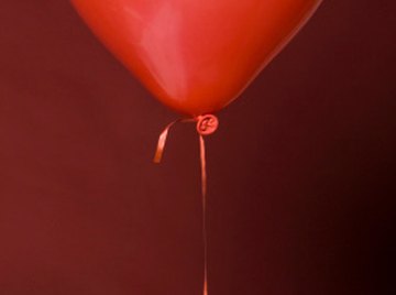 Helium balloons float because they are much lighter than air.