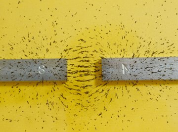 Iron filings show the magnetic field lines of two bar magnets.