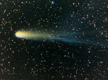 Comets approaching the sun develop luminous tails that extend for long distances.