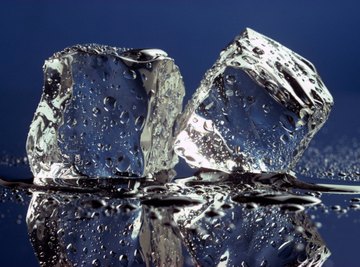 Ice melts as heat energy overcomes forces between molecules.