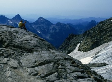 Weathering occurs when the atmosphere acts upon stationary rock