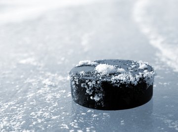 When a hockey puck slides across the ice, it does so at a fairly constant speed until it hits the goal or a player’s stick. Although it’s moving, it’s not accelerating.