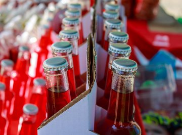 Carbonated drinks such as soft drinks are bubbly because carbon dioxide gas is dissolved under pressure in the liquid at the bottling plant.