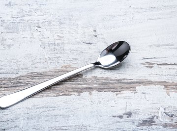 Explain the process of electroplating clearance a steel spoon with silver