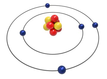 Protons and neutrons form the nucleus, or center, of the atom, while electrons circle around the nucleus