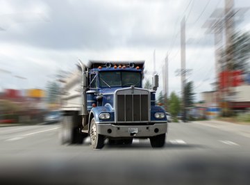 Hydraulic systems are used to empty dump trucks.