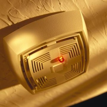 A small hole may be drilled in a smoke detector for a microphone.