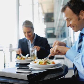 Businessman and businesswoman having lunch