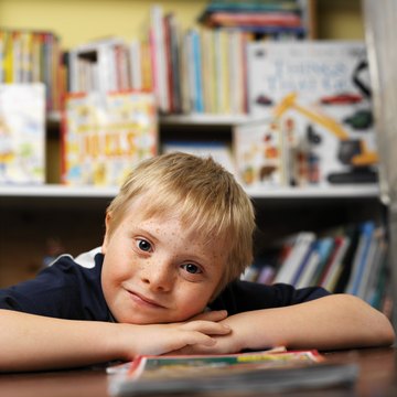 Children who can't talk may communicate by pointing to pictures in a communication book.