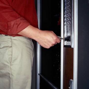 Man Inserting Paper Currency in a Vending Machine