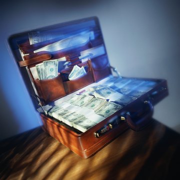 Briefcase filled with bundles of US money